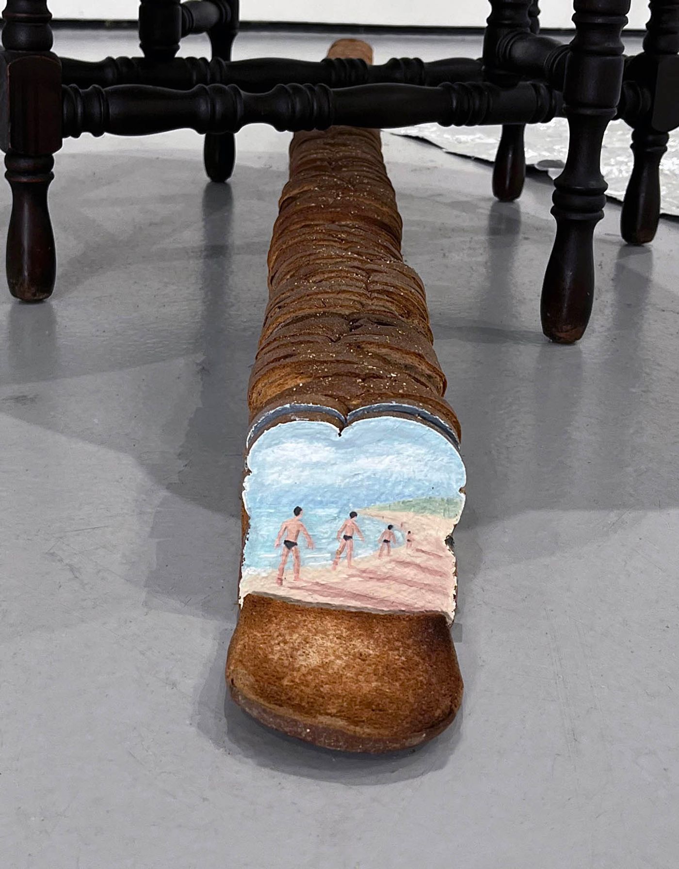 The flâneur, the loafer, 2022. Oil on toasts; 5 inches x 5 inches x 140 inches. Photo: Matt Smoak.